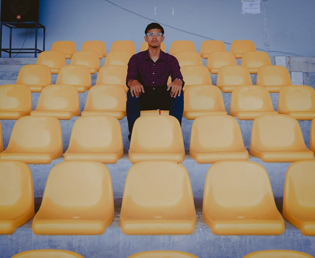 Speaker presenting to a seated audience of executives